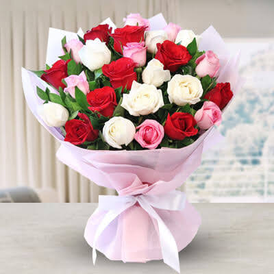 Cherish the moment with our darling flower bouquet. A tender fusion of pink, red, and white roses adorned with ruscus whispered sweet sentiments of love