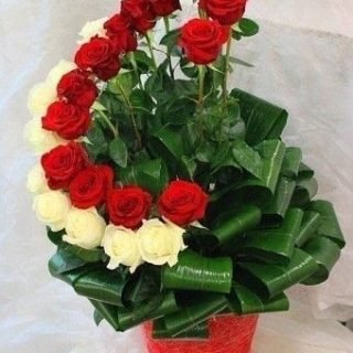 Shop same-day fresh flowers bouquets online in Nairobi, Kenya, My Sweet Smile has 30 stems of red and white roses and greenery with a red vase