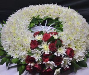 Shop same-day fresh flowers delivery in Nairobi, Kenya, with Special Round Wreath Arrangement with red roses, white chrysanthemums, and ruscus