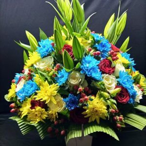 Shop same-day fresh flowers, Summer Glow arrangement of lilies, yellow and blue chrysanthemums, alstroemeria, hypericum, greenery arranged in a flower vase