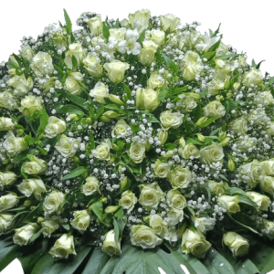 Order a stunning casket flower arrangement with exquisite white roses and delicate baby's breath for same-day funeral flower delivery in Nairobi.