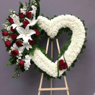 Cherish memories with our special heart wreath arrangement. A loving tribute, weaving sentiments of remembrance and comfort in every bloom. #HeartWreath