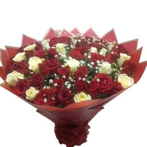 A beautifully arranged Sweet Valentine Bouquet featuring red and white roses, wrapped elegantly in red packaging, perfect for romantic occasions like Valentine's Day and anniversaries