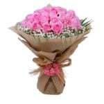 Order same-day flowers of the Smile bouquet of pink roses and a baby