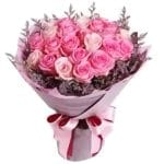 Elegance is in bloom with Two Dozen Roses Bouquet features pink roses and purple fillers, a harmonious blend for a touch of timeless beauty
