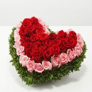 Winter Grace Love Box with fresh red and pink roses, greenery, and a premium gift box