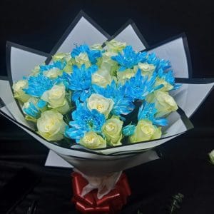 The Perfect Match Bouquet combines elegant white roses and bold blue chrysanthemums in a stunning display. A perfect gift for any occasion. Same-day flower delivery in Nairobi!