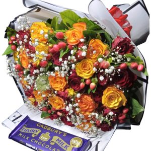 Share joy with the Whimsical Wonder bouquet featuring yellow and red roses, hypericum, baby's breath, and Cadbury chocolate for a sweet touch.