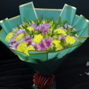 A vibrant bouquet of alstroemeria, yellow chrysanthemums, and purple chrysanthemums, arranged in a lively and cheerful display.