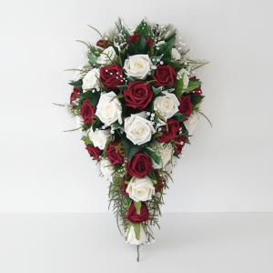 Red & white rose cascading bridal bouquet with baby's breath and greenery for a wedding in Nairobi Kenya.