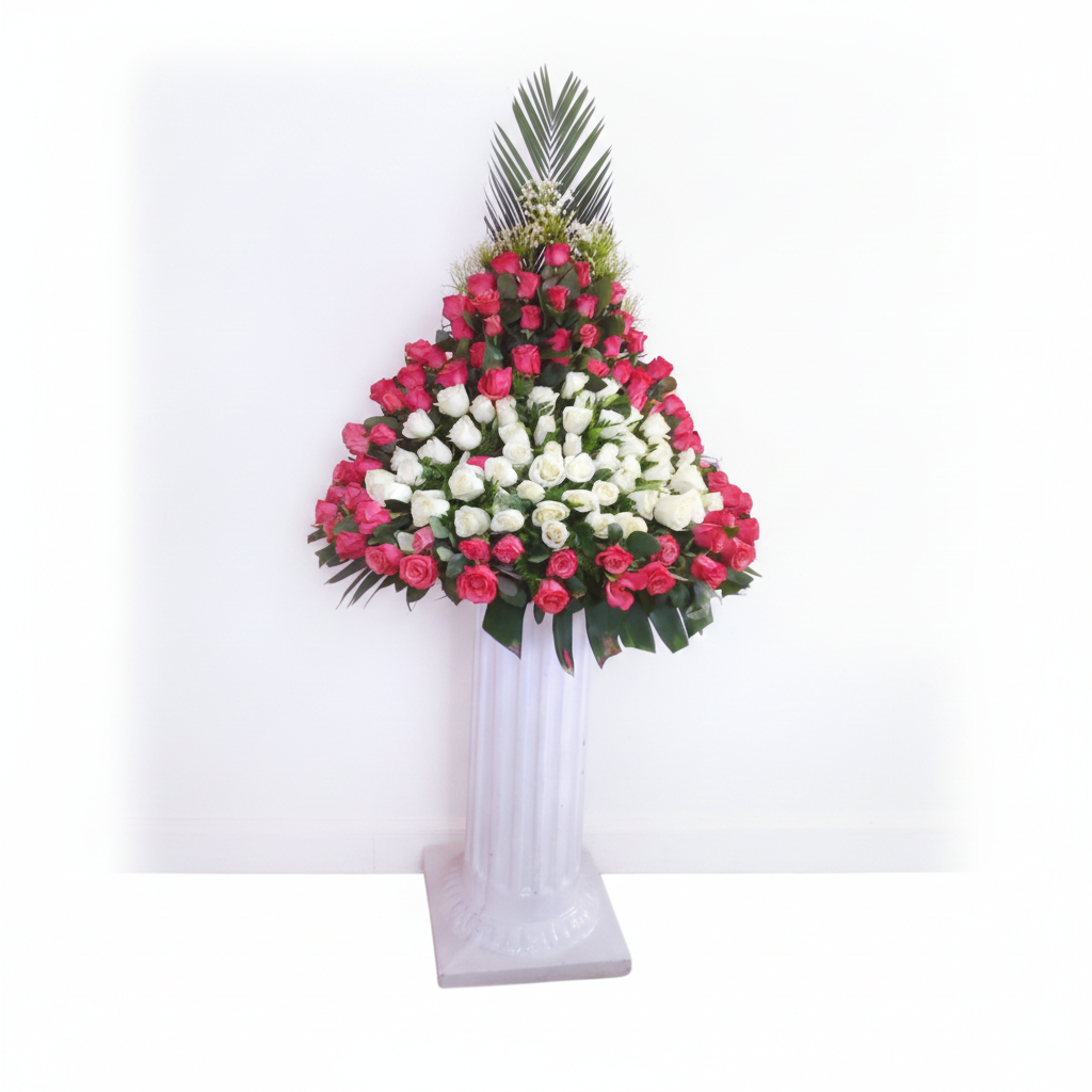 Standing Bouquet Arrangement | Red & White Roses Nairobi Standing bouquet arrangement with red and white roses in a triangular design and tall tropical foliage in Nairobi Kenya.