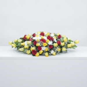 Roses Mix Table Arrangement with red and yellow roses, white blooms, baby's breath and greenery in Nairobi Kenya.